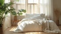 Bed with white blanket and pillows in front of window, World Sleep Day concept, boho style apartment design Royalty Free Stock Photo