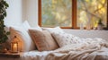 Bed with white blanket and pillows in front of window, World Sleep Day concept, boho style apartment design Royalty Free Stock Photo