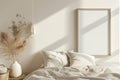 Bed With White Comforter and Vase With Dried Flowers