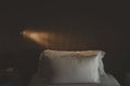 Bed with white linens with lamp in a hotel Royalty Free Stock Photo