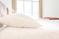 A bed with white sheets and pillows close up at a hotel appartment Royalty Free Stock Photo