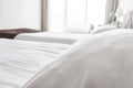 A bed with white sheets and pillows close up at a hotel appartment Royalty Free Stock Photo