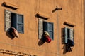 Bedcovers hanging out of windows