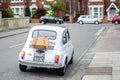 Bedford, Bedfordshire, UK June 2 2019. Classic Fiat 500 car with a picnic basket on a road in England. Shot from behind