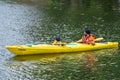 Bedford, Bedfordshire, UK. June 2, 2019.Family kayaking. Dad and son paddling in kayak on the river. Soft focus