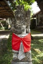 A bedogol guardian carved stone statue in a temple in Bali, Indonesia.