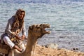 Bedouin and camel by the beach, Dahab, Egypt