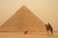 Bedouin on a camel near Pyramid of Khafre in a sand strom, Cairo Royalty Free Stock Photo