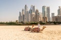 Bedouin with camels on the background of Dubai Marina skyscrapers Royalty Free Stock Photo