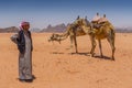 Bedouin with camels in the desert Wadi Rum, Jordan, Middle East Royalty Free Stock Photo
