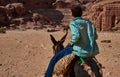 Bedouin child ride your donkey Petra Royalty Free Stock Photo