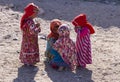 Bedouin children entertain tourists. Kids of the Sahara desert. Aboriginal children share what they get by begging