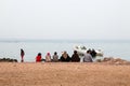 Bedouin familiy on beach Dahab, Sinai, Egypt. Traditional bedouin lifestyle, clothes. Fishing in Red Sea.