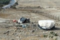 Bedouin houses in the desert near Dead Sea. Poor regions of the world. A indigent Bedouin sitting at the tent. Poverty Royalty Free Stock Photo