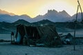 Bedouin hut in the desert against the backdrop of the mountains at sunset. Hurghada, Egypt.