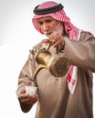 Bedouin old man offer arabic coffe