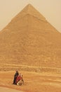 Bedouin resting near Pyramid of Khafre during sand storm, Cairo Royalty Free Stock Photo