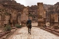 Bedouin riding a Camel in Petra, Jordan Royalty Free Stock Photo