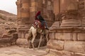 Bedouin riding a Camel in Petra, Jordan Royalty Free Stock Photo