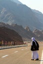 Bedouin stands on the road Royalty Free Stock Photo