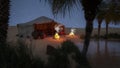Bedouin tent in an oasis in the desert at night with stars in the sky. 3D illustration