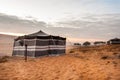 Bedouin tents in desert on sun rise, wahiba sand,oman Royalty Free Stock Photo