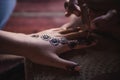 Bedouine, making henna on a womans hand Royalty Free Stock Photo