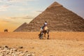 Bedouins in Giza desert near the Great Pyramids of Egypt