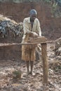 Mudbrick former standing barefoot in clay in Uganda