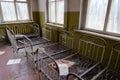 Bedroom in abandoned kindergarten in destroyed village of Kopachi 10 km exclusion zone of Chernobyl Nuclear Power Plant, Ukraine