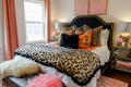 Bedroom accessories with animal print. Bed with animal patterned cushions. Generative AI