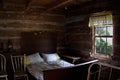 Bedroom in antique historic log cabin