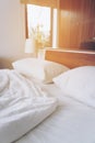 Bedroom and bedding sheets and pillow. Messy bed concept.White themed bed sheets and pillows messed up after nights sleep. copy Royalty Free Stock Photo