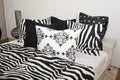 Bedroom with black and white pillows
