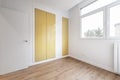 Bedroom with built-in wardrobe with mustard yellow