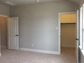 Bedroom with closet in new modern house Royalty Free Stock Photo