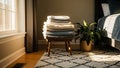 Bedroom corner featuring a stack of folded towels on a wooden Royalty Free Stock Photo