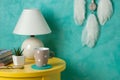 Bedroom decor on aquamarine background Royalty Free Stock Photo