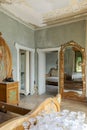 Bedroom detail with two entrance doors. Interior of an abandoned villa to be restored