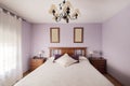 bedroom with double bed with wooden headboard with matching