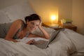 Bedroom evening - woman with laptop