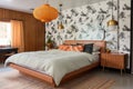 bedroom featuring a platform bed, pendant lights, and retro wallpaper