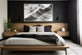 a bedroom featuring a streamlined wooden bed, monochrome bedding, and bold wall art Royalty Free Stock Photo