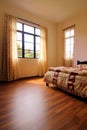 Bedroom with Hardwood Flooring Royalty Free Stock Photo