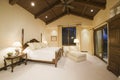 Bedroom With High Wooden Ceiling