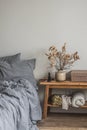 Bedroom interior - bed, bench with autumn decor. Cozy Scandinavian style interior Royalty Free Stock Photo