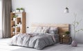 Bedroom interior in beige and baby pink color. Gray bedding .Natural wooden head board. White light background Royalty Free Stock Photo