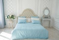 Bedroom interior. beige bed with blue linen in a white spacious airy room