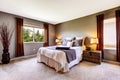 Bedroom interior with carpet floor and big bed