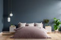 Bedroom interior in dark style,dark blue wall mockup